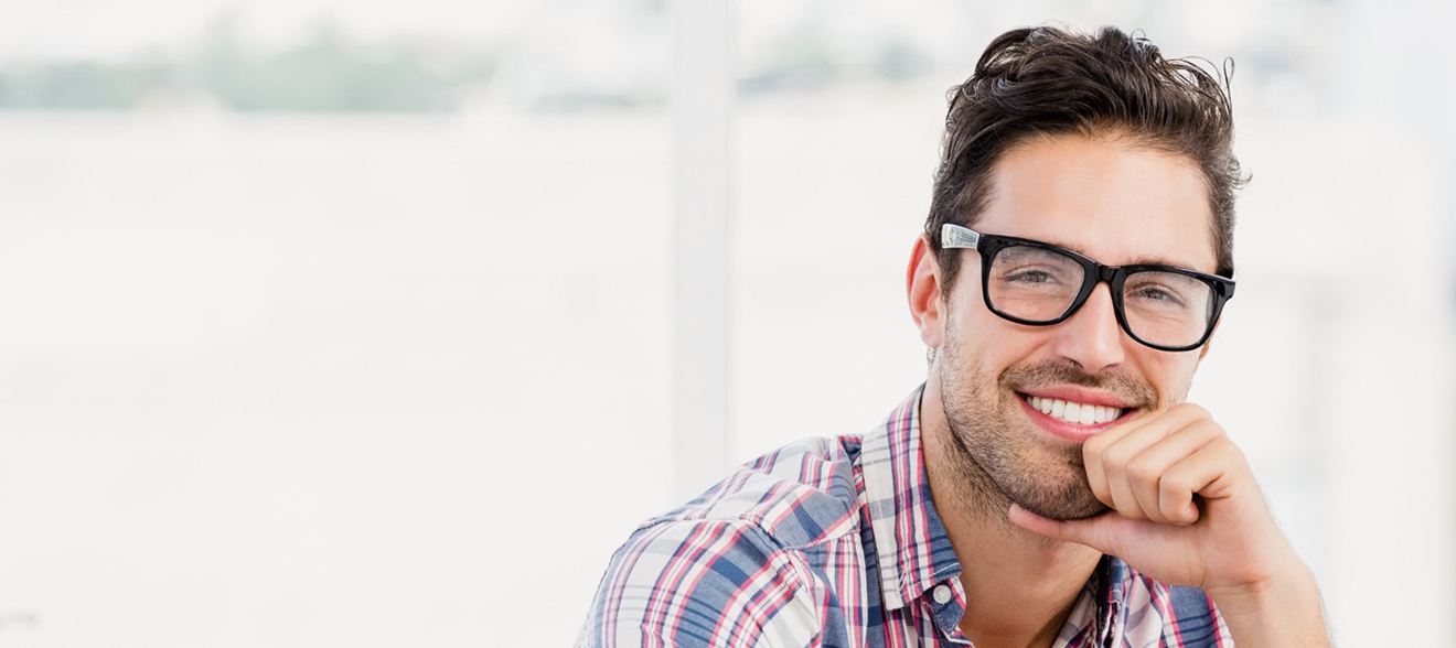 Man with specs smiling | Local Seo Services Los Angeles | Ontrix