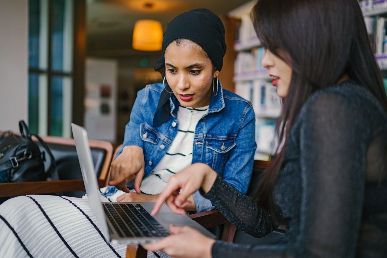two people working in a laptop | Los Angeles seo company | Ontrix